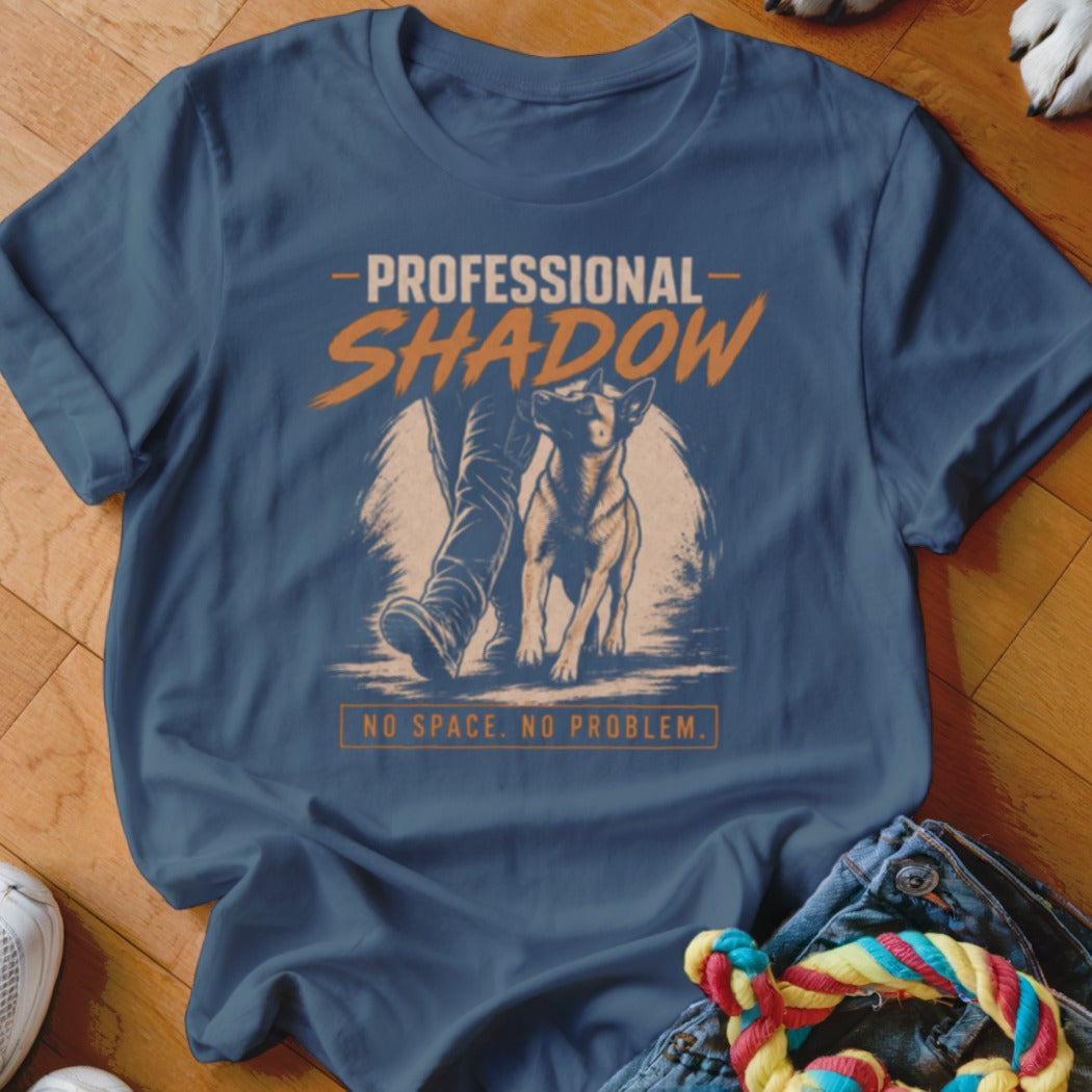 Blue t-shirt with dog and person graphic, "Professional Shadow, No Space. No Problem."