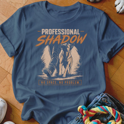 Blue t-shirt with dog and person graphic, "Professional Shadow, No Space. No Problem."