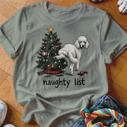 White poodle next to a Christmas tree with the text "naughty list"