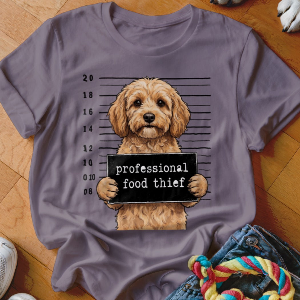 T-shirt with a dog mugshot holding a "professional food thief" sign.