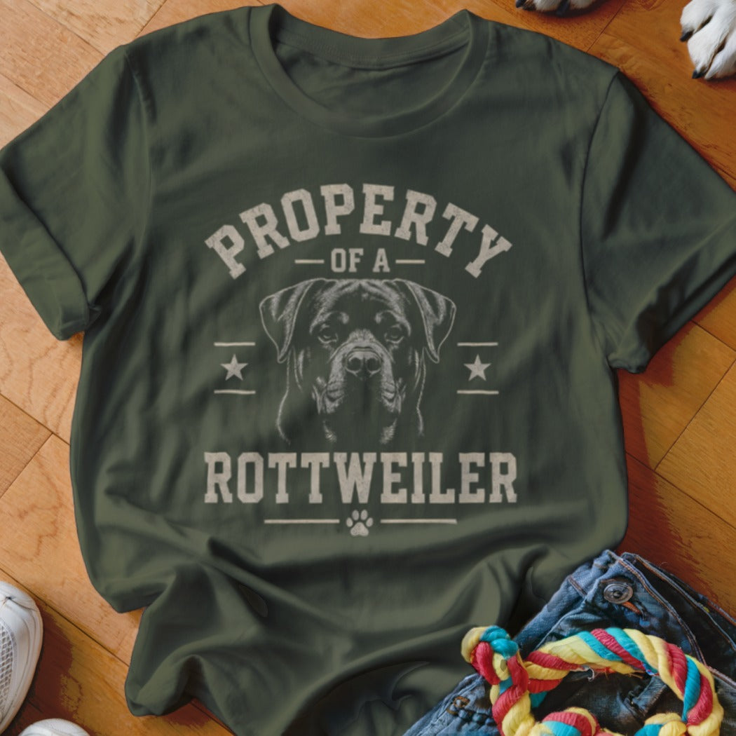 Olive green t-shirt with a Rottweiler graphic and text "PROPERTY OF A ROTTWEILER".