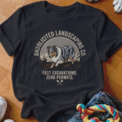 Dark t-shirt with a blue merle dog and "Unsolicited Landscaping Co." text.