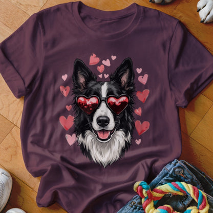 Dark purple t-shirt featuring a graphic of a black and white dog wearing heart-shaped sunglasses, surrounded by pink hearts.