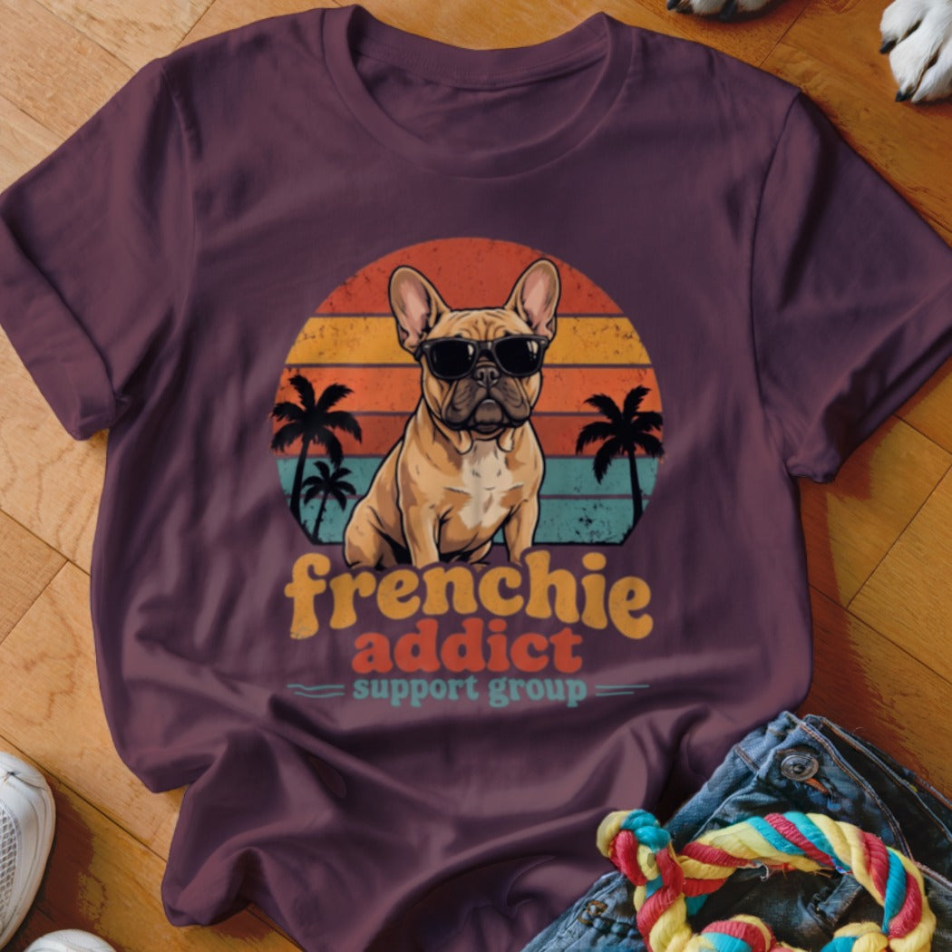 Maroon t-shirt featuring a retro graphic of a French Bulldog in sunglasses with palm trees and sunset stripes.