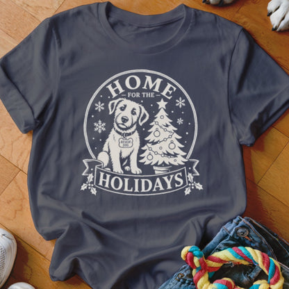 White graphic on navy t-shirt with rescue dog, Christmas tree, and text "HOME FOR THE HOLIDAYS".