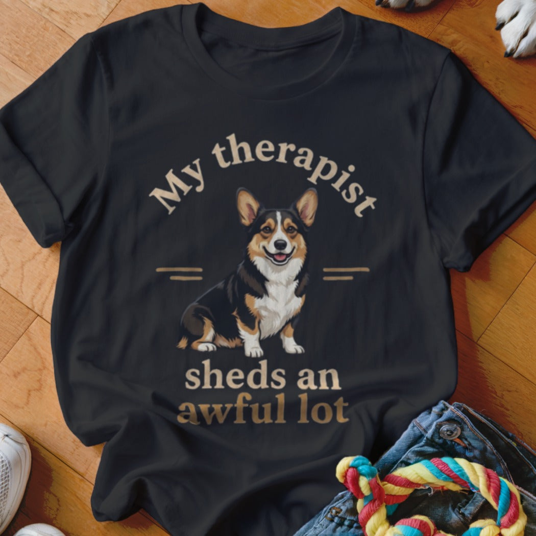 Black t-shirt with a corgi illustration and text "My therapist sheds an awful lot".