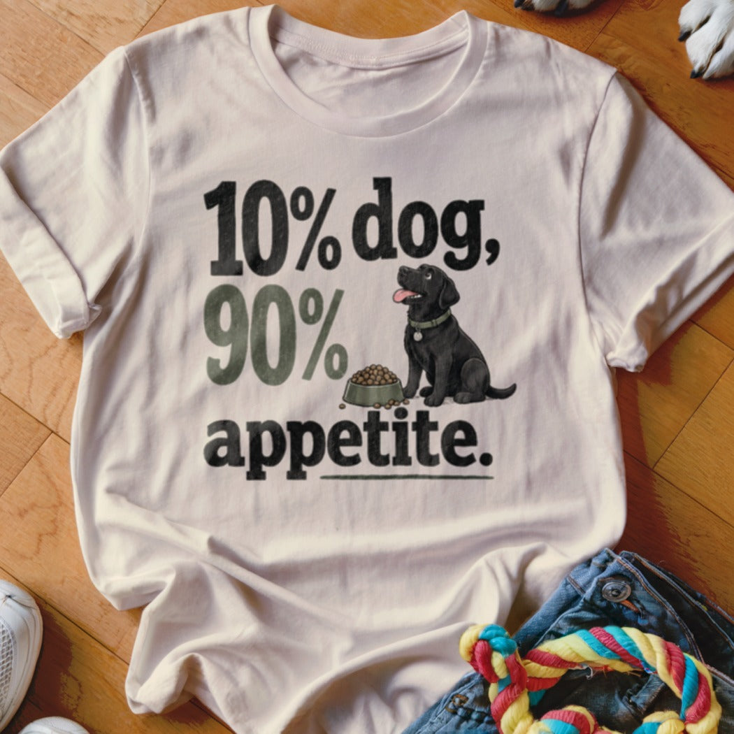 White t-shirt with black and green text and a black lab with a bowl of food.