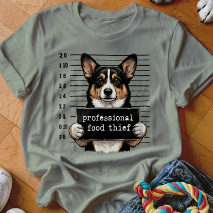 Corgi with a mugshot sign that reads "professional food thief".