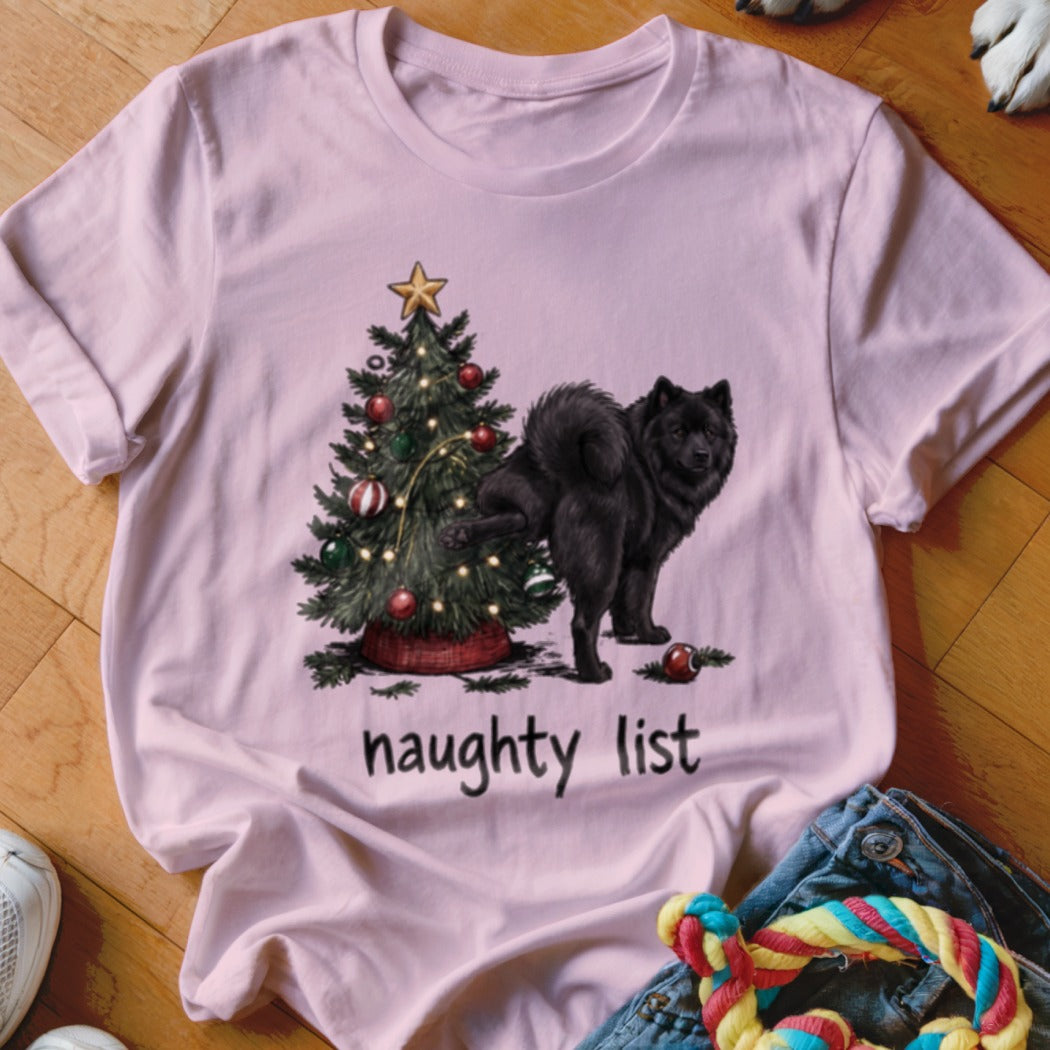 Black dog peeing on Christmas tree with text "naughty list".