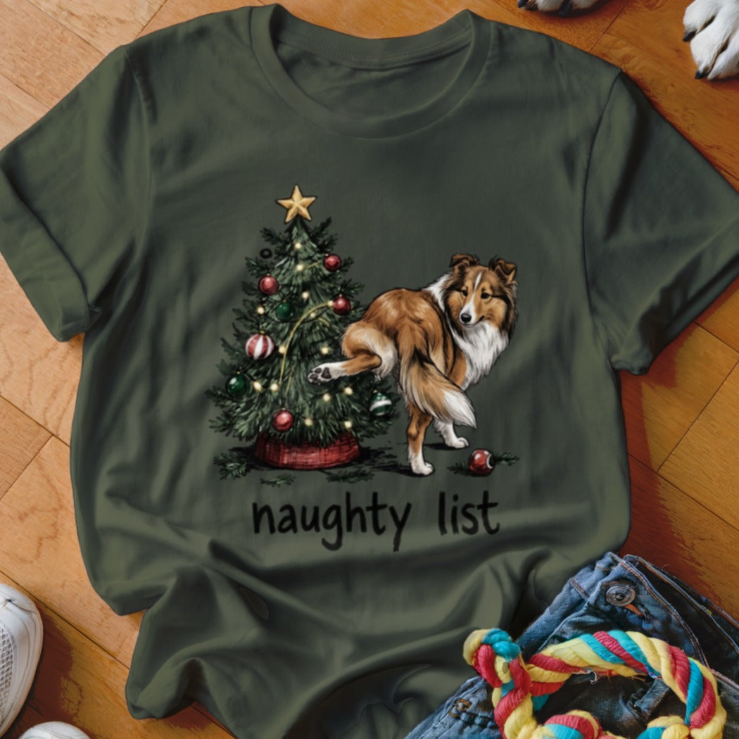Shetland sheepdog near Christmas tree with "naughty list" text.