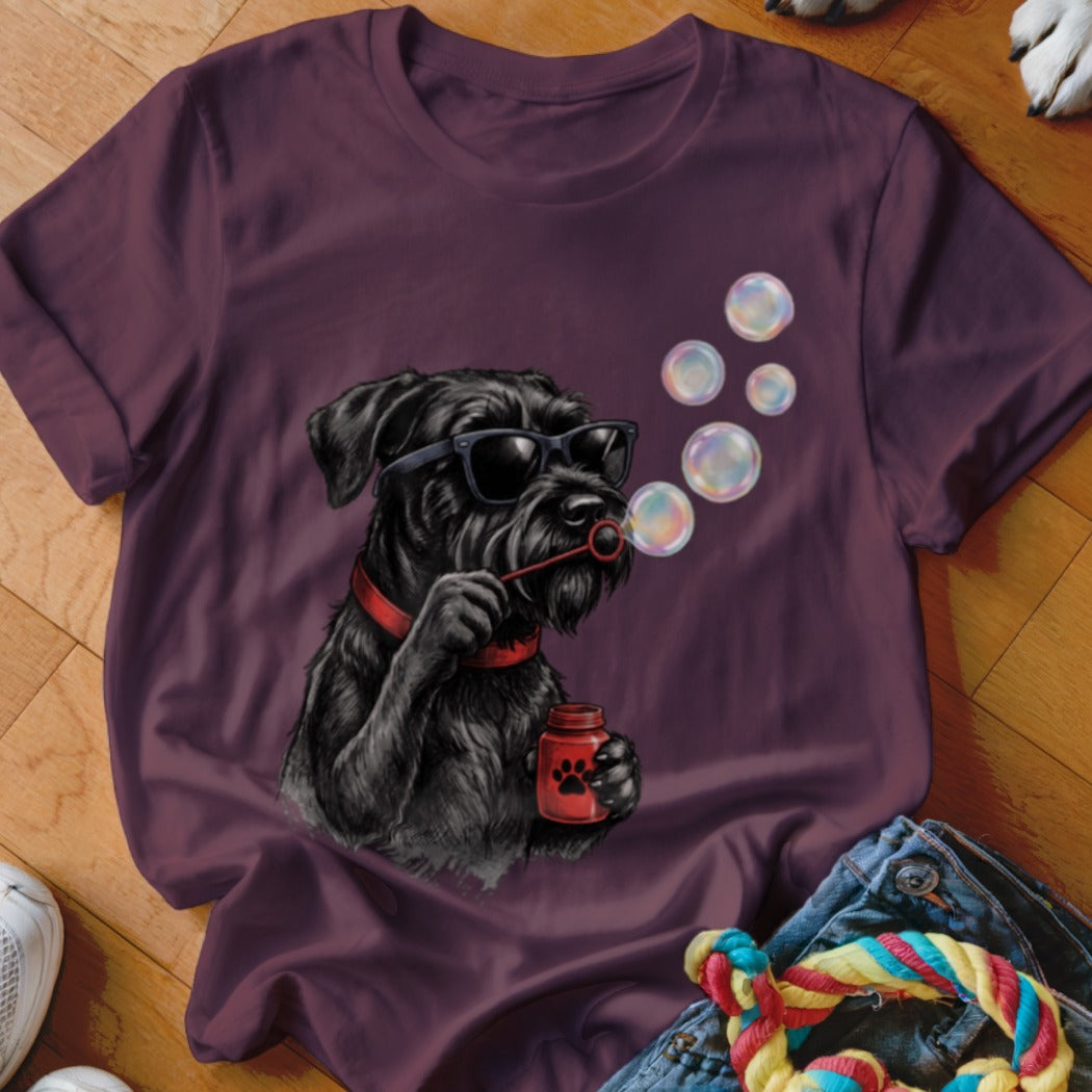 Dark purple t-shirt featuring a graphic of a black schnauzer wearing sunglasses and blowing bubbles.