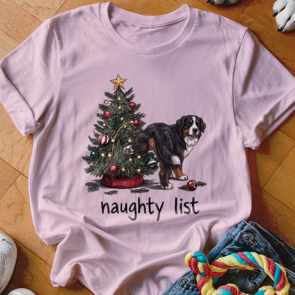 Light pink t-shirt featuring a Bernese Mountain Dog lifting its leg on a Christmas tree, with the text "naughty list" below.