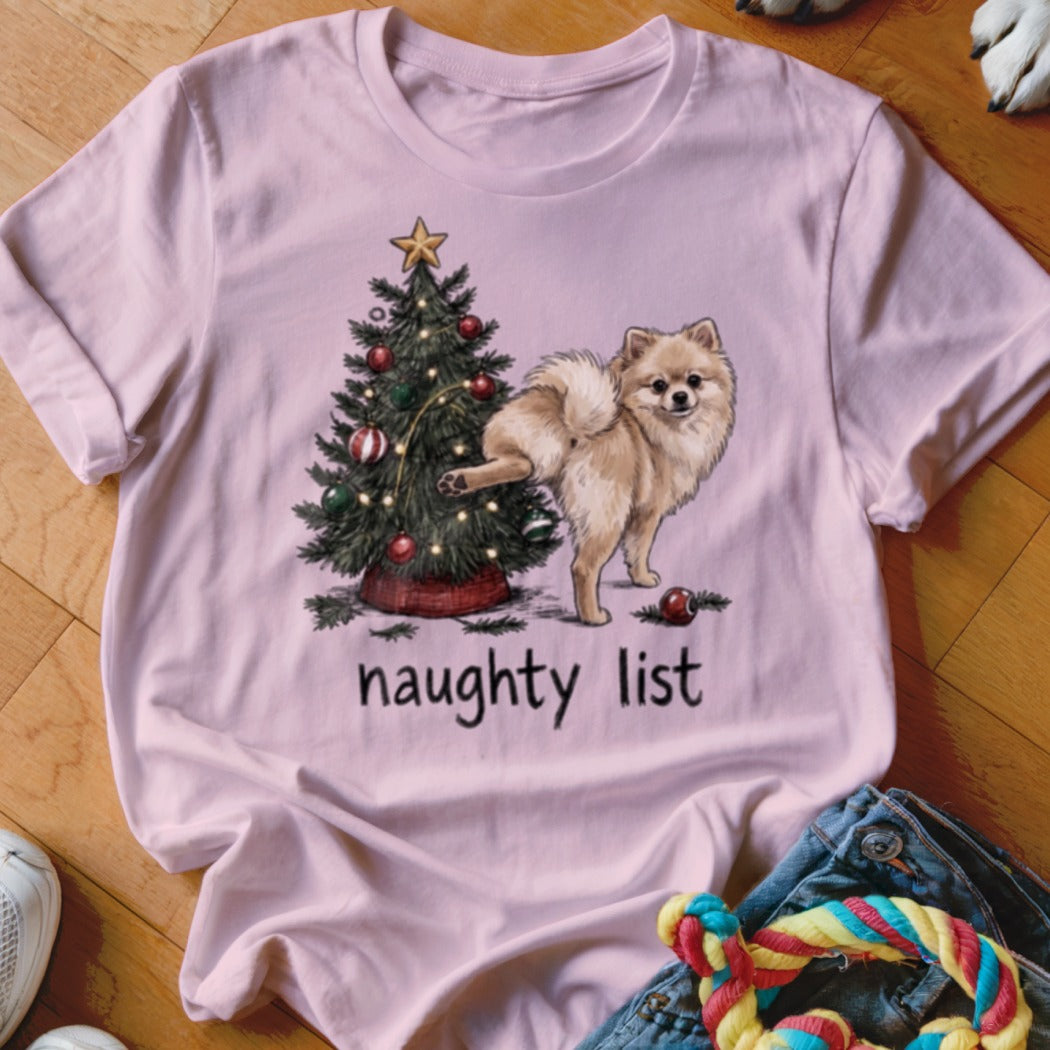 Pink t-shirt with Christmas tree and Pomeranian dog, text "naughty list".