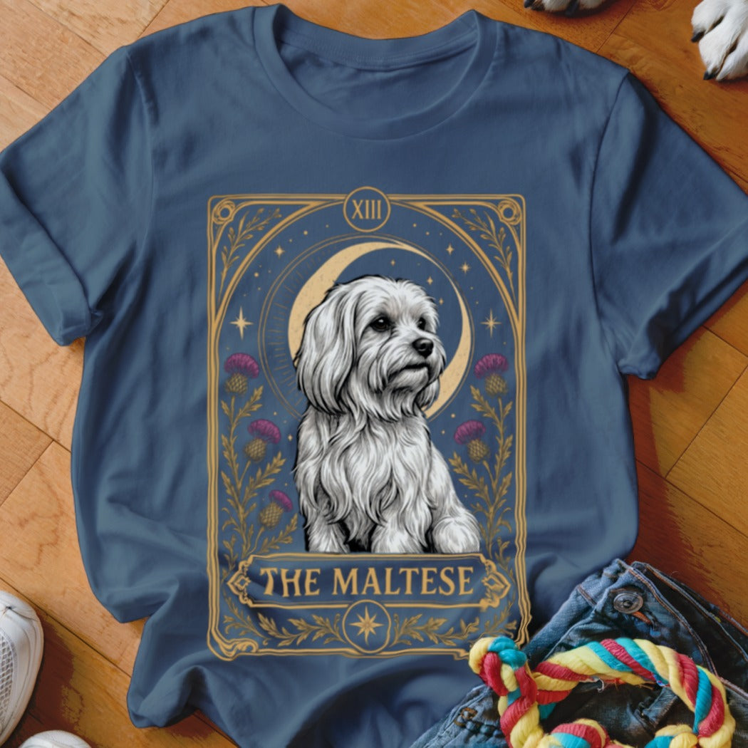 Navy blue t-shirt featuring a tarot card graphic of a white Maltese dog with purple flowers and a crescent moon.