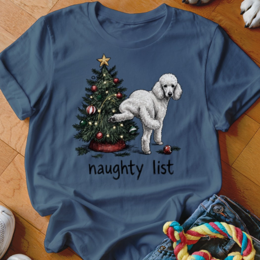 White poodle next to Christmas tree with text "naughty list."