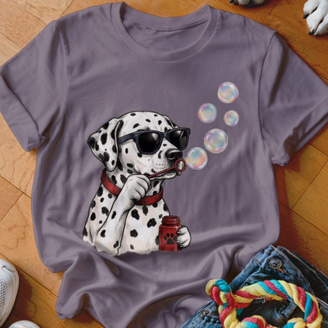 A mauve crew-neck t-shirt featuring a graphic of a Dalmatian wearing sunglasses and blowing bubbles.
