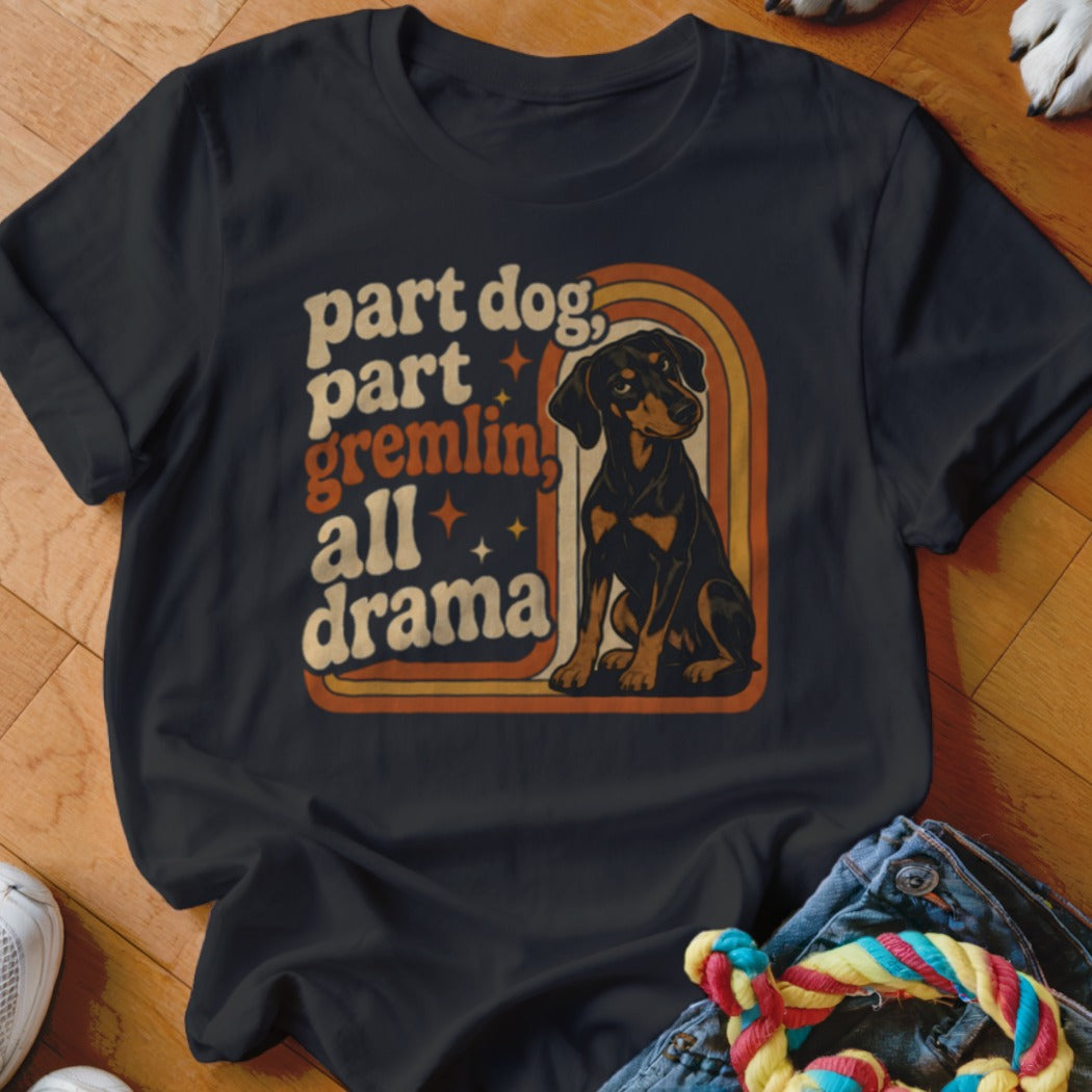 Dark t-shirt with text "part dog, part gremlin, all drama" and a sitting dog.