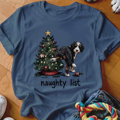 Bernese Mountain Dog next to Christmas tree with text "naughty list"