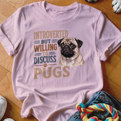 Pink t-shirt with pug graphic and text "Introverted but willing to discuss pugs".