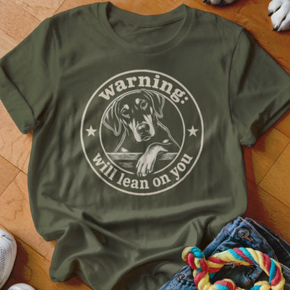 Green t-shirt with circular graphic of a Doberman leaning on a fence with text "warning: will lean on you".