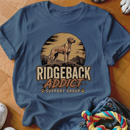 A dark blue crewneck t-shirt featuring a vintage-style graphic of a Ridgeback dog standing on a ridge against a sunset, with text reading Ridgeback Addict Support Group.