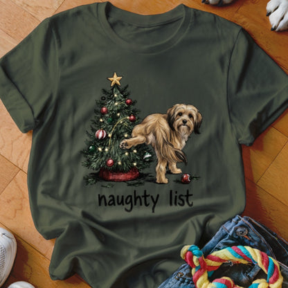 Tan dog peeing on a Christmas tree with text "naughty list" below.
