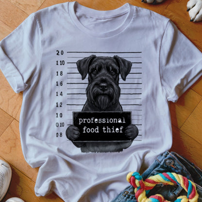Black schnauzer mugshot graphic with text "professional food thief" on a white t-shirt.