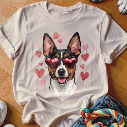 A beige t-shirt featuring a graphic of a dog wearing heart-shaped sunglasses, surrounded by pink hearts.