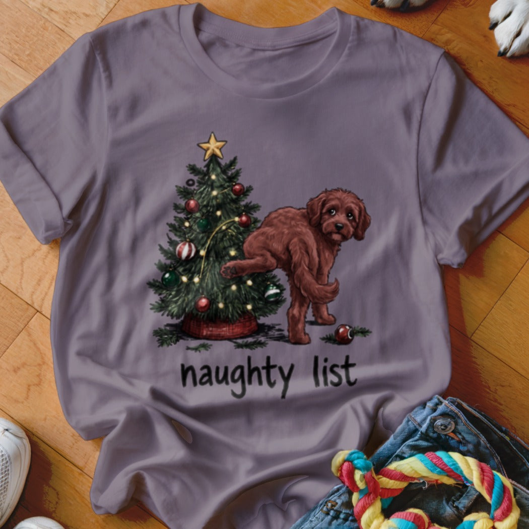 Brown dog pees on Christmas tree with "naughty list" text below.