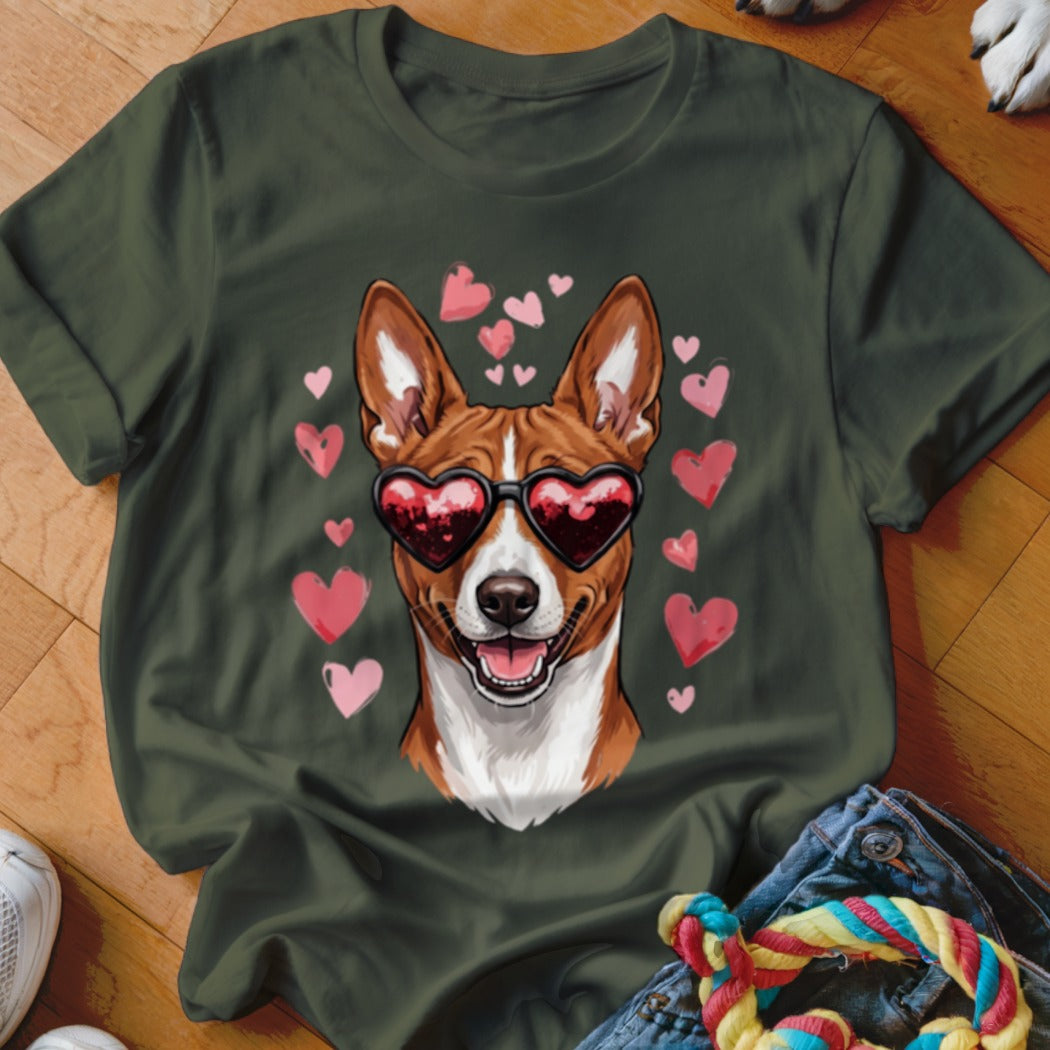 Dark green t-shirt featuring a graphic of a brown and white dog wearing heart-shaped sunglasses surrounded by pink hearts.