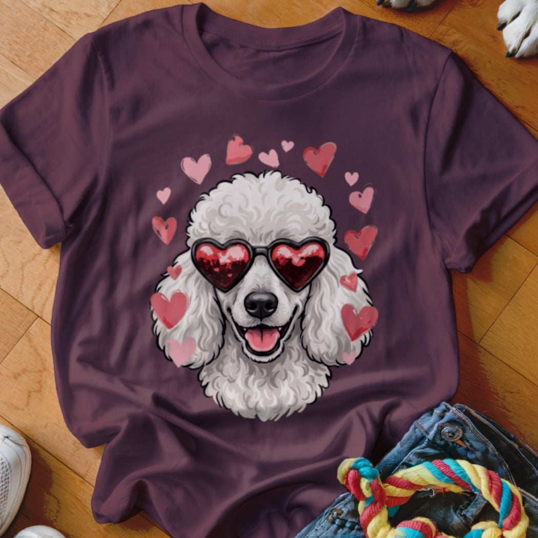 Dark purple t-shirt featuring a graphic of a white poodle wearing heart-shaped sunglasses surrounded by pink hearts.