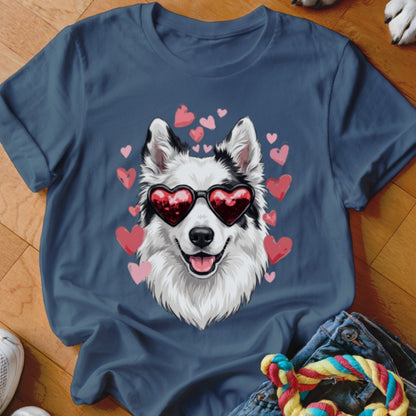 Blue t-shirt featuring an illustrated white and black dog wearing heart-shaped sunglasses, surrounded by pink hearts.