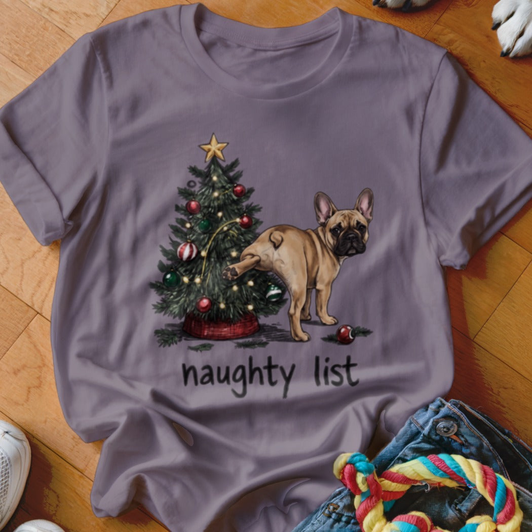 French bulldog pees on Christmas tree with text "naughty list".