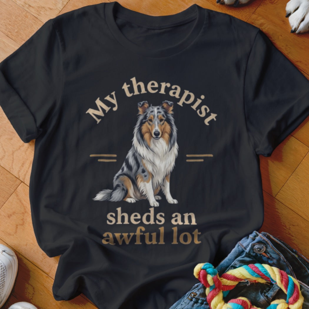 Black t-shirt with a blue merle Collie and text "My therapist sheds an awful lot."