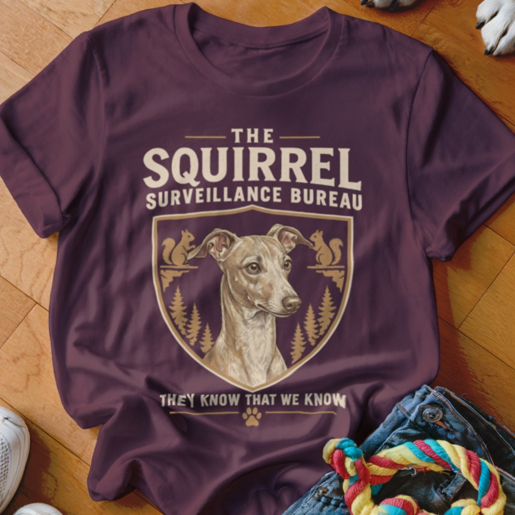 Maroon short-sleeved t-shirt featuring a graphic of an Italian Greyhound inside a crest with squirrel illustrations and text.