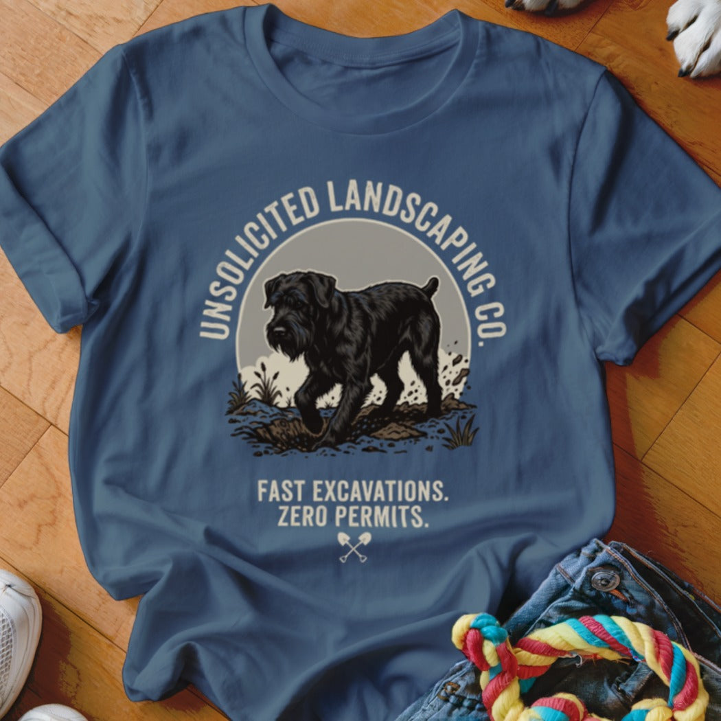 Blue t-shirt with graphic of black dog digging, text "UNSOLICITED LANDSCAPING CO. FAST EXCAVATIONS. ZERO PERMITS."
