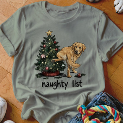 Golden retriever dog with leg raised next to a Christmas tree, with "naughty list" text.