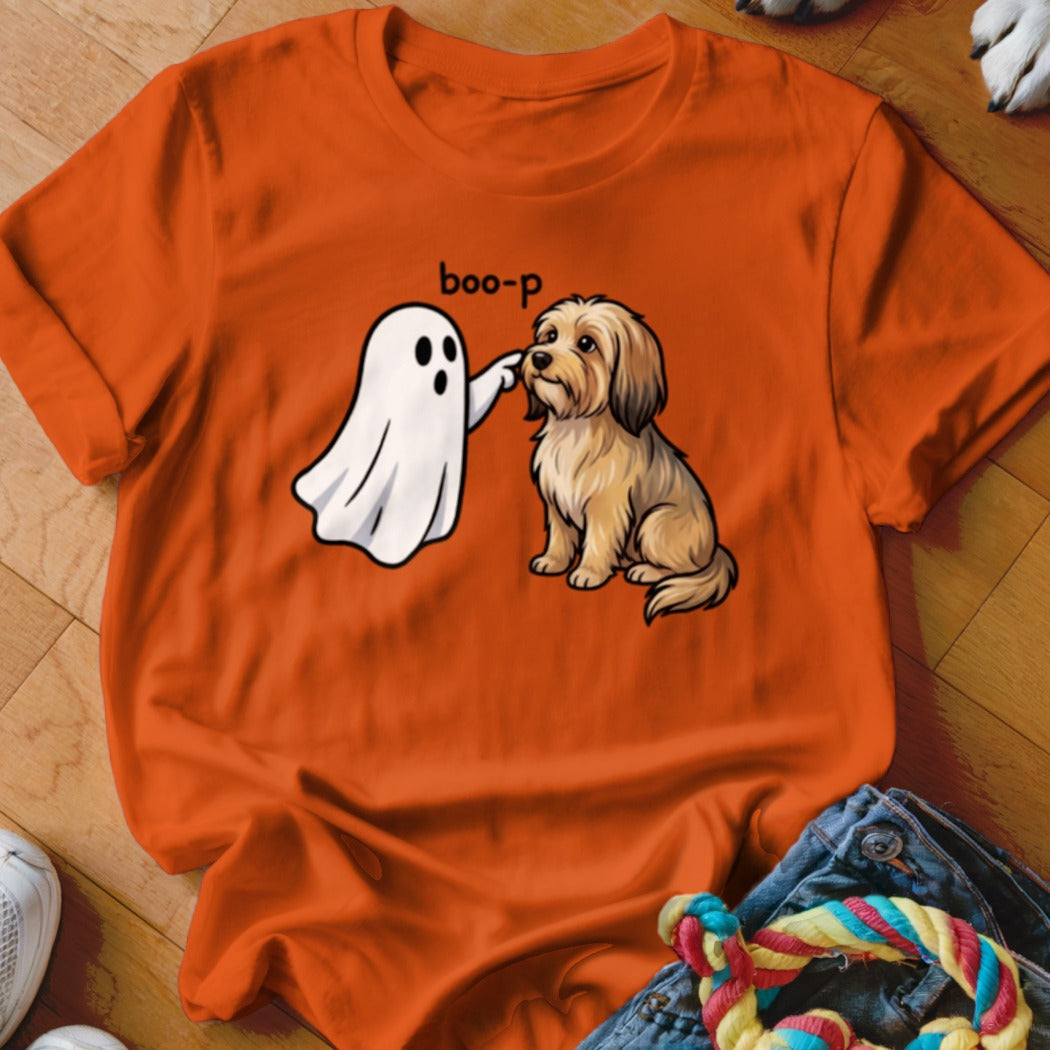 Ghost boops a cute, fluffy dog with "boo-p" text on orange t-shirt.