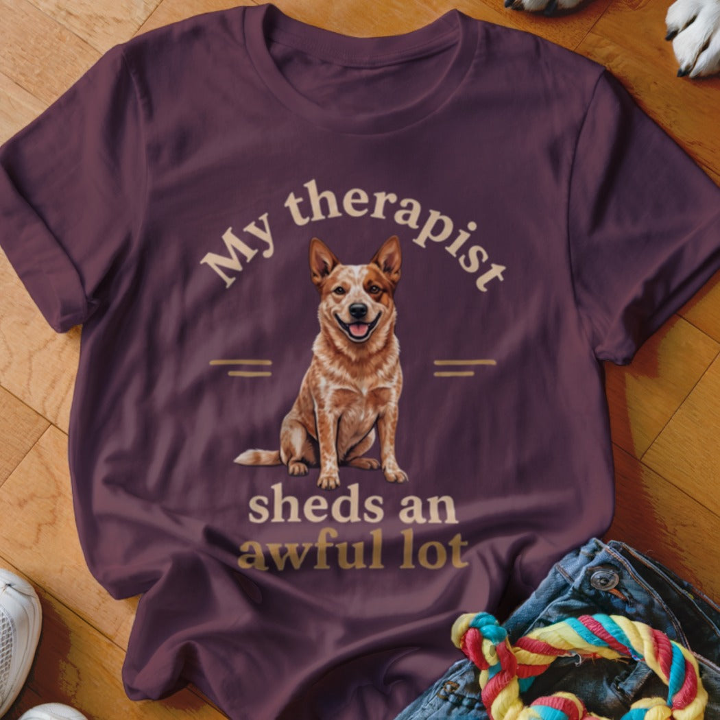 Maroon t-shirt with a red heeler dog and text: "My therapist sheds an awful lot".