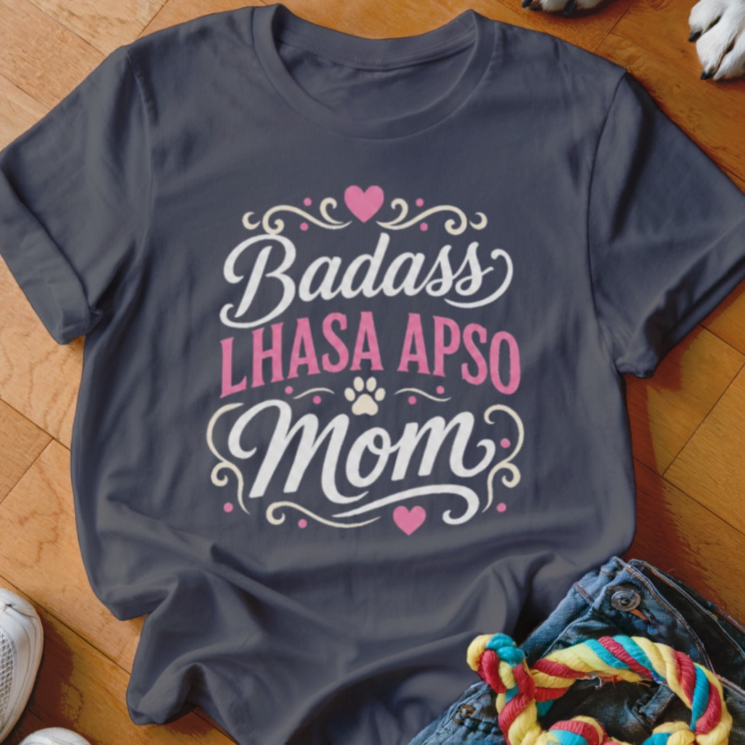 Dark gray t-shirt with "Badass Lhasa Apso Mom" text and dog paw design.