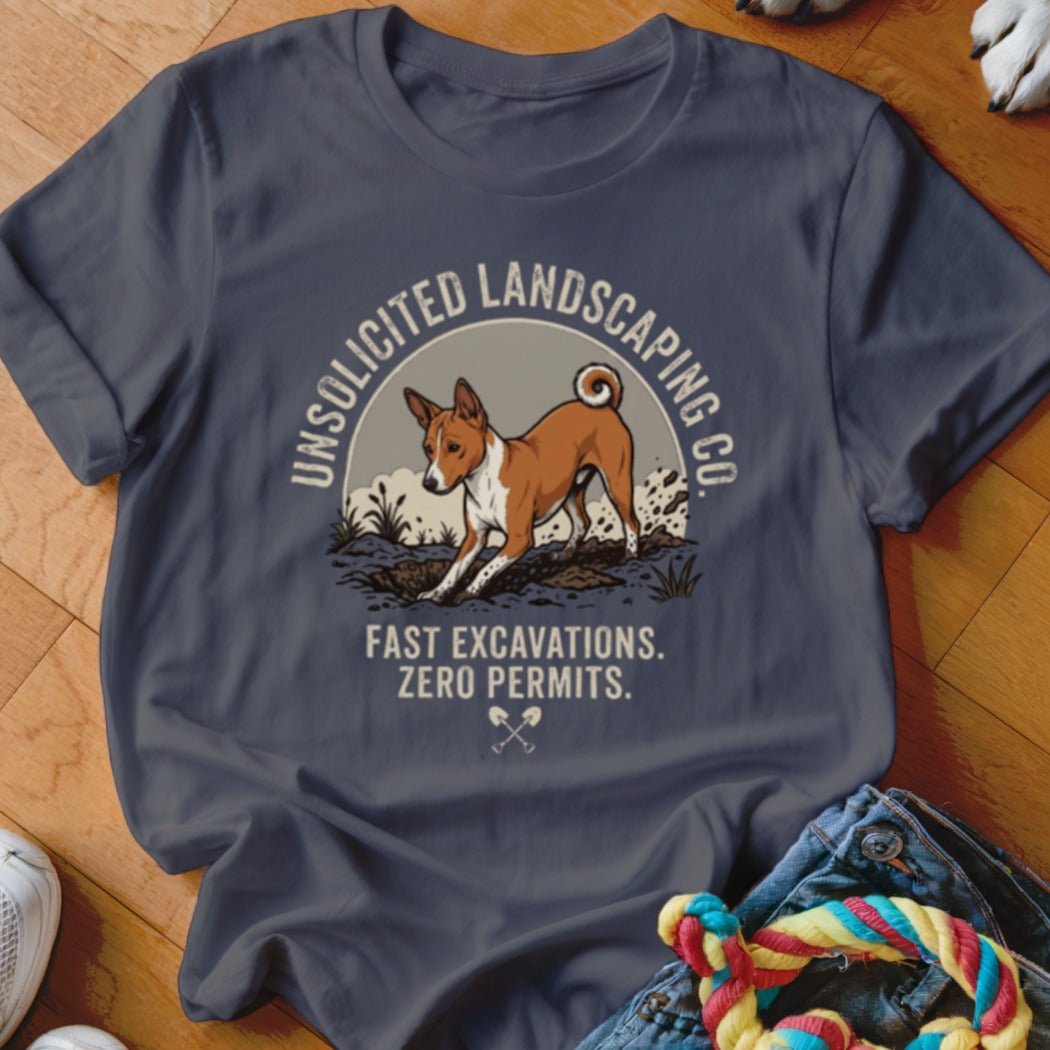 Basenji dog digging in dirt with "Unsolicited Landscaping Co." text.