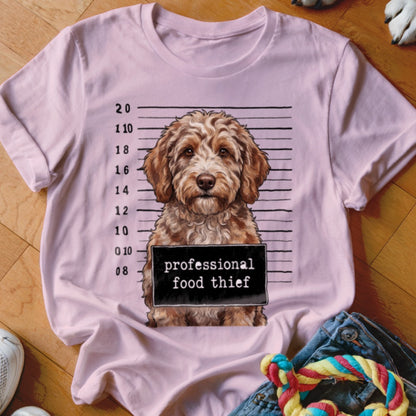 Pink t-shirt with a dog mugshot graphic reading "professional food thief".