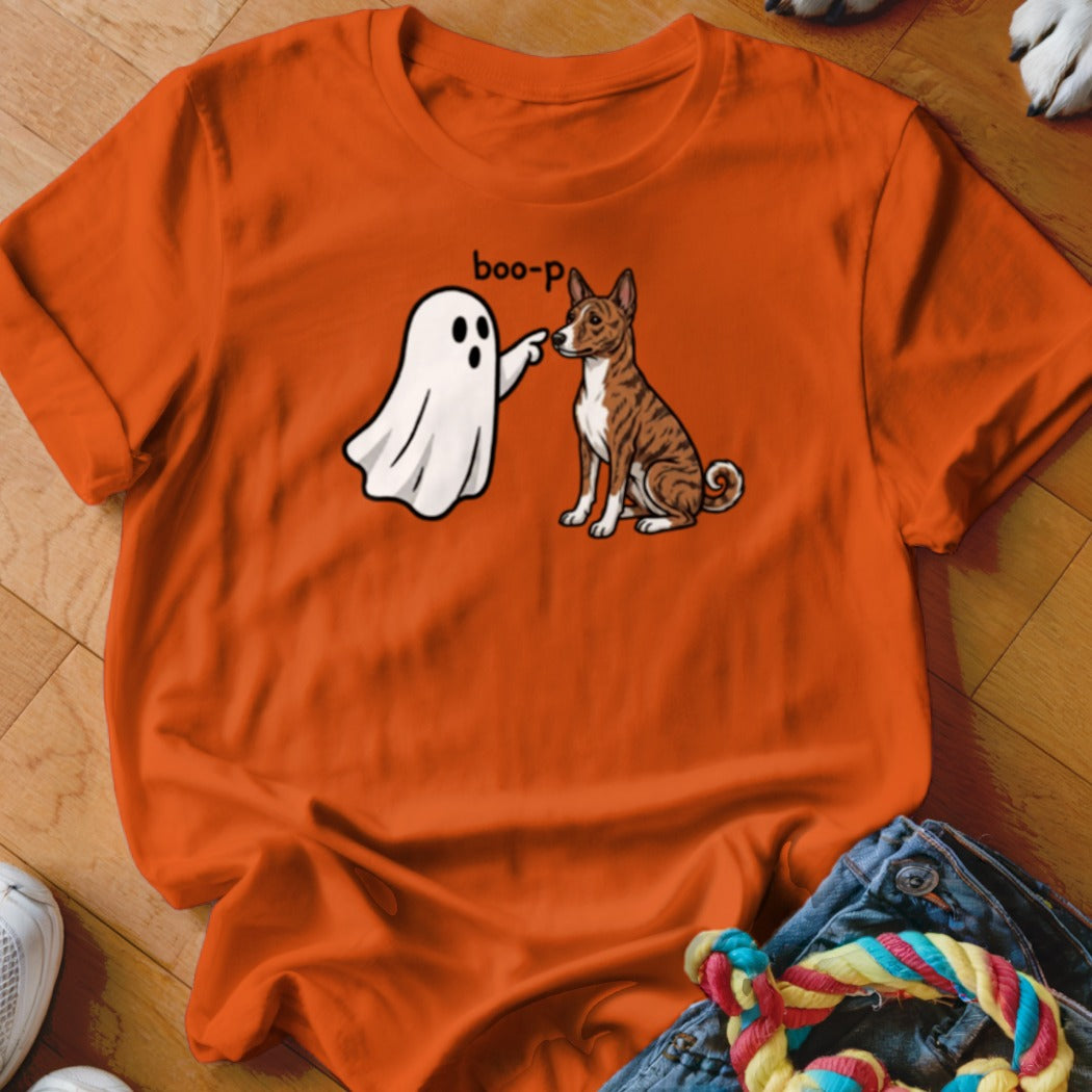 Orange t-shirt with cartoon ghost saying "boo-p" to a sitting dog.