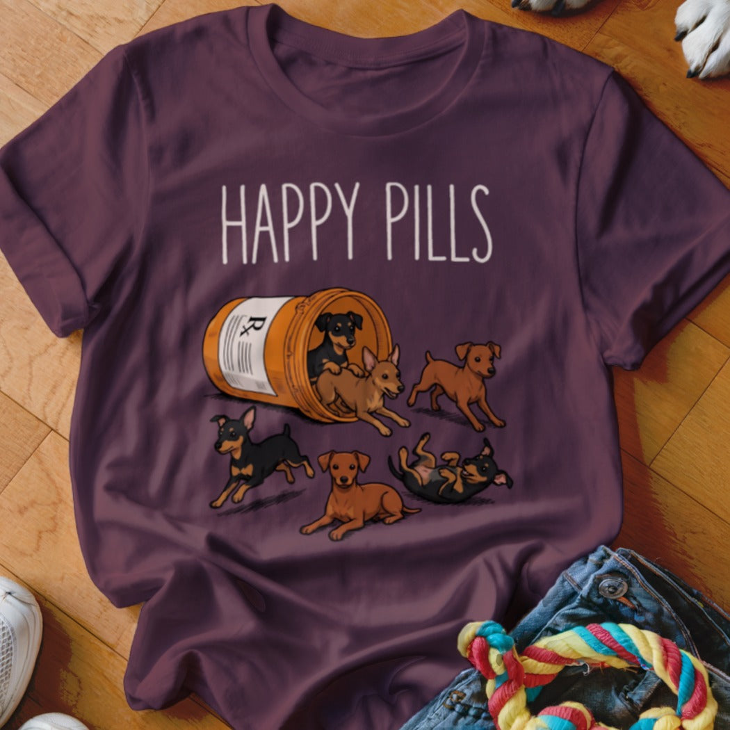 T-shirt with "HAPPY PILLS" and cartoon dogs spilling from a medicine bottle.