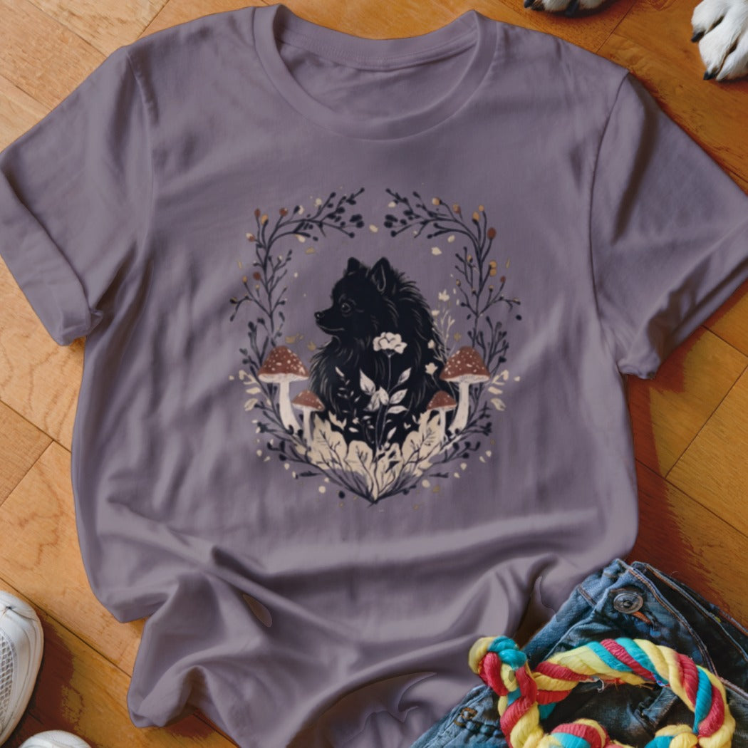 Grey crewneck t-shirt featuring a black Pomeranian graphic surrounded by botanical illustrations and mushrooms.