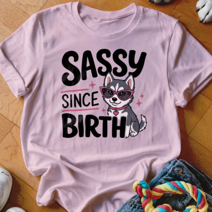 Pink t-shirt with "Sassy Since Birth" text and a cartoon husky wearing sunglasses.