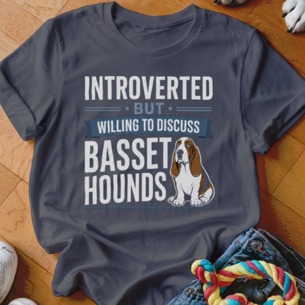 T-shirt with "Introverted but willing to discuss basset hounds" text and illustration.