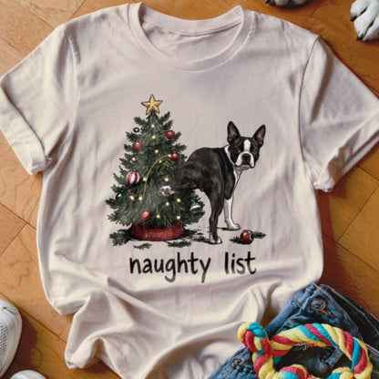 Boston Terrier dog near Christmas tree with "naughty list" text.