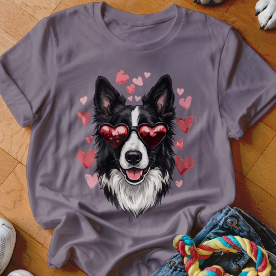 Mauve t-shirt featuring a graphic of a black and white dog wearing heart-shaped sunglasses surrounded by floating pink hearts.