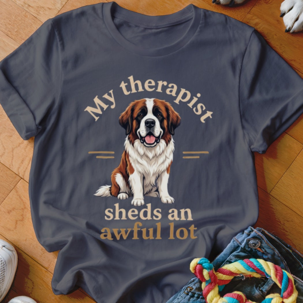 Dark gray t-shirt with a Saint Bernard dog graphic and text: "My therapist sheds an awful lot."